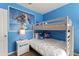 bedroom with bunk beds, Frozen wall art, and a white nightstand at 5234 Wildwood Way, Davenport, FL 33837