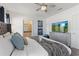 Comfortable bedroom boasting a king-size bed and a wall-mounted television above a dresser at 5234 Wildwood Way, Davenport, FL 33837