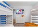 bedroom showcasing bunk beds and a TV mounted above a white dresser at 5234 Wildwood Way, Davenport, FL 33837