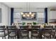 Formal dining room is well lit and set for a dinner party at 5234 Wildwood Way, Davenport, FL 33837