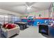 Game room includes a pool table, air hockey, and Marvel superhero themed decor at 5234 Wildwood Way, Davenport, FL 33837