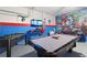 Entertainment space with pool table, foosball, and Marvel-themed decor, perfect for fun at 5234 Wildwood Way, Davenport, FL 33837