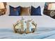 Comfortable bed with decorative pillows and morning refreshments with a gold mirrored serving tray at 5234 Wildwood Way, Davenport, FL 33837