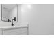 Bathroom features a modern vanity with a black faucet and large mirror at 5415 Fairwood Way # 303, Orlando, FL 32808