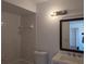 Bathroom featuring a shower-tub combination with tile surround at 5415 Fairwood Way # 303, Orlando, FL 32808