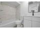Clean bathroom with white tiling and modern fixtures at 5415 Fairwood Way # 303, Orlando, FL 32808