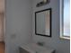 This bathroom includes a vanity with mirror and a light at 5415 Fairwood Way # 303, Orlando, FL 32808