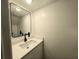 Modern half-bathroom with new vanity, sink, and matte black faucet at 5415 Fairwood Way # 303, Orlando, FL 32808