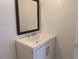 Bathroom features a vanity with sink and mirror at 5415 Fairwood Way # 303, Orlando, FL 32808