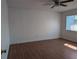 Bedroom features a window, a ceiling fan, and wood flooring at 5415 Fairwood Way # 303, Orlando, FL 32808