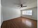 Bedroom featuring hardwood floors, a ceiling fan, and bright natural light at 5415 Fairwood Way # 303, Orlando, FL 32808