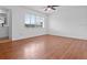 Spacious bedroom with laminate floors and large window at 5415 Fairwood Way # 303, Orlando, FL 32808