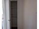 Open closet with multiple wire rack shelves at 5415 Fairwood Way # 303, Orlando, FL 32808