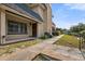 Exterior view of a two story home with a walkway leading to the front door and a grass area at 5415 Fairwood Way # 303, Orlando, FL 32808