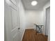 Upstairs hallway with wood flooring leading to bedrooms at 5415 Fairwood Way # 303, Orlando, FL 32808