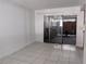 Bright living room with tile flooring and sliding glass doors to the outside at 5415 Fairwood Way # 303, Orlando, FL 32808