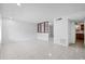 Bright living room featuring tile flooring, white walls, and an open floor plan at 5415 Fairwood Way # 303, Orlando, FL 32808