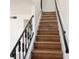 Wooden staircase with decorative black metal railing at 5415 Fairwood Way # 303, Orlando, FL 32808