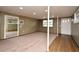 Spacious basement featuring wood paneled walls, carpeted floors and plenty of natural light at 623 Camellia Ct, Sanford, FL 32773