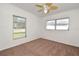 Bedroom featuring neutral walls, brown carpet, ceiling fan, and windows at 623 Camellia Ct, Sanford, FL 32773