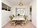 Bright dining area with a large window and stylish light fixture at 623 Camellia Ct, Sanford, FL 32773