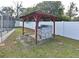 Backyard with outdoor grill, privacy fence, and lush landscaping at 623 Camellia Ct, Sanford, FL 32773