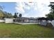 Backyard oasis with a screened-in pool and gazebo area at 623 Camellia Ct, Sanford, FL 32773