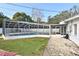 Backyard pool area with screened-in pool, deck, and yard at 623 Camellia Ct, Sanford, FL 32773