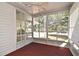 Relaxing screened porch offers views of the front yard with functional ceiling fan at 623 Camellia Ct, Sanford, FL 32773