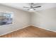 Bedroom featuring hardwood floors and a window with blinds at 700 E Airport Blvd # C7, Sanford, FL 32773