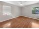 Bedroom with hardwood floors and a ceiling fan at 700 E Airport Blvd # C7, Sanford, FL 32773