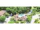 Aerial view of the community clubhouse, pool, pond, manicured landscaping, and parking at 713 Crest Pines Dr # 227, Orlando, FL 32828