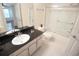 Bathroom features a granite countertop, a sink, a toilet and glass enclosed shower at 713 Crest Pines Dr # 227, Orlando, FL 32828