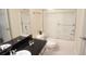 Bathroom features a granite countertop, a sink, a toilet and glass enclosed shower at 713 Crest Pines Dr # 227, Orlando, FL 32828