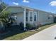 Charming home exterior featuring well-manicured landscaping, stone accents, and a clean, modern design at 723 Polo Park East Blvd, Davenport, FL 33897