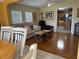 Cozy living room featuring hardwood floors and comfortable seating next to the kitchen at 723 Polo Park East Blvd, Davenport, FL 33897