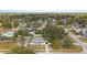 Aerial view of the home showcasing mature trees and a well-maintained yard in a residential neighborhood at 7331 Blue Jacket W Pl, Winter Park, FL 32792