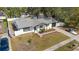 Aerial view of a home with a pool and updated roof at 7331 Blue Jacket W Pl, Winter Park, FL 32792