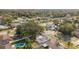 An aerial view showcases this home with a fenced yard and mature trees, plus a neighborhood swimming pool at 7331 Blue Jacket W Pl, Winter Park, FL 32792