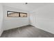 Empty bedroom featuring modern lighting, and a bright window at 7331 Blue Jacket W Pl, Winter Park, FL 32792