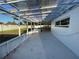 View of a screened-in porch with a transparent ceiling and a partially visible hot tub at 7331 Blue Jacket W Pl, Winter Park, FL 32792