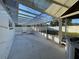 View of a screened-in porch with a transparent ceiling and a partially visible hot tub at 7331 Blue Jacket W Pl, Winter Park, FL 32792