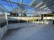 View of a screened-in porch with a transparent ceiling and a partially visible hot tub at 7331 Blue Jacket W Pl, Winter Park, FL 32792