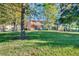 View of townhomes with balconies and outdoor seating on a spacious lawn near a playground at 8452 Crystal Cove Loop, Kissimmee, FL 34747