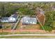 An aerial view shows a house with a brick wall surrounding the backyard at 851 Benchwood Dr, Winter Springs, FL 32708