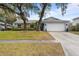 Charming single-story home with a two-car garage and well-manicured lawn at 851 Benchwood Dr, Winter Springs, FL 32708