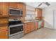 Updated kitchen featuring stainless steel appliances and granite countertops at 851 Benchwood Dr, Winter Springs, FL 32708