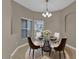 Cozy dining area with a glass table, stylish chairs, and soft lighting, creating a welcoming atmosphere at 864 Stonechase Ln, Lake Mary, FL 32746