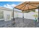 Outdoor patio area with pavers, string lights, and privacy fence, great for entertaining at 8933 Newmarket Dr, Windermere, FL 34786