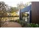 Exterior view of home's back yard showing wood deck, modern architectural details and pool view at 8966 Easterling Dr, Orlando, FL 32819